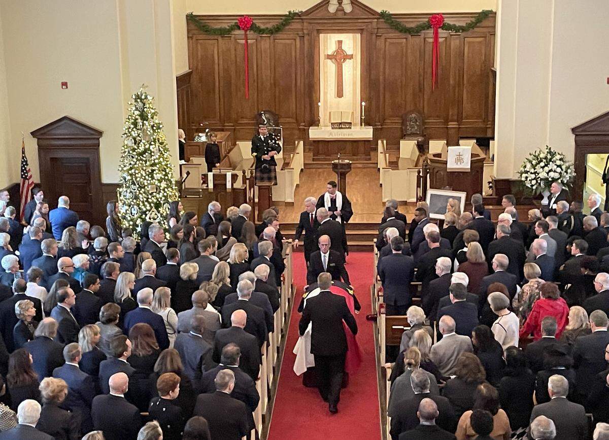 The casket of former North Carolina Gov. Jim Hunt is removed from the sanctuary of First Presbyterian Church during the recessional of his funeral on Dec. 26, 2025, in Wilson.