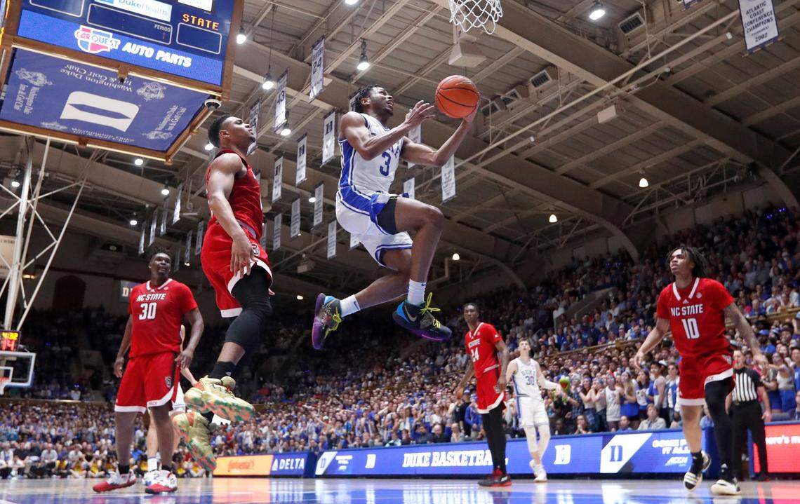 Duke’s Jeremy Roach (3) drives past N.C. State’s Casey Morsell (14) to the basket during Duke’s 71-67 victory over N.C. State at Cameron Indoor Stadium in Durham, N.C., Tuesday, Feb. 28, 2023.