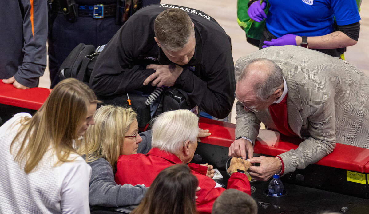 Wendell Murphy is attended to after North Carolina’s Harrison Ingram drove into the seats around Murphy for a loose ball at mid-court in the second half against N.C. State on Wednesday, January 10, 2024 at PNC Arena in Raleigh, N.C. Murphy said following the game he was not injured.