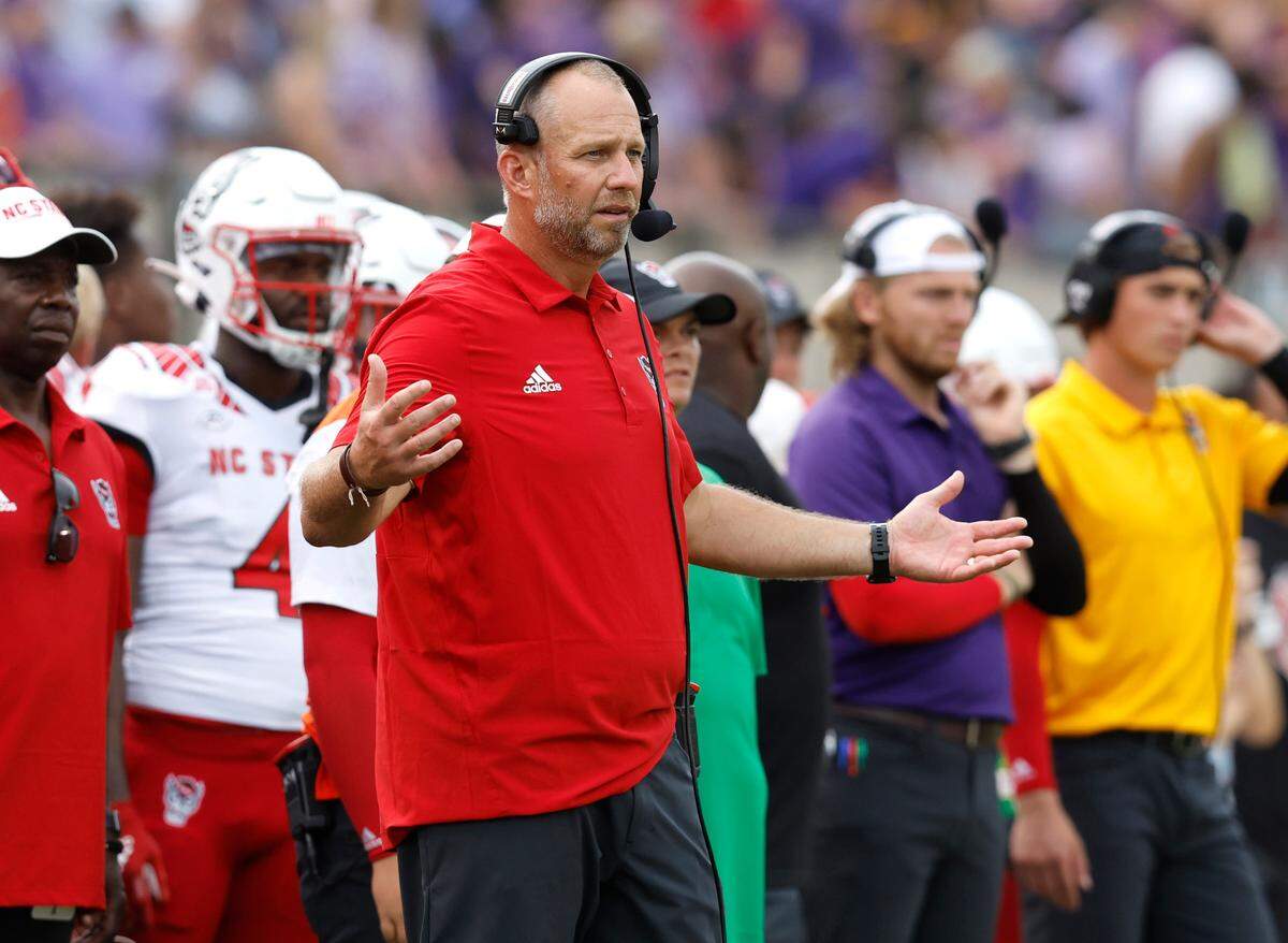 N.C. State head coach Dave Doeren questions the official’s call during the second half of N.C. State’s 21-20 victory over ECU at Dowdy-Ficklen Stadium in Greenville, N.C., Saturday, Sept. 3, 2022.
