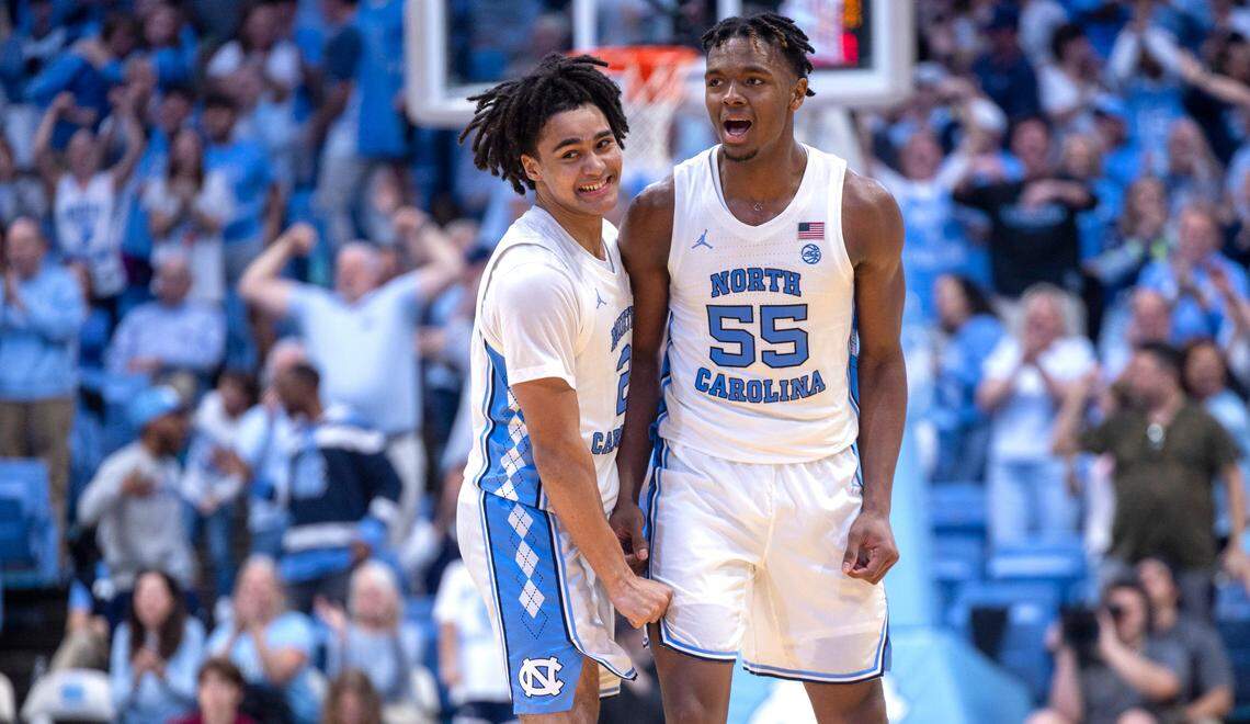 North Carolina’s Elliot Cadeau (2) and Harrison Ingram (55) react after a Cadeau basket to give the Tar Heels’ a 58-56 lead, after overcoming a fourteen point Florida State lead, in the second half on Saturday, December 2, 2023 at the Smith Center in Chapel Hill, N.C.