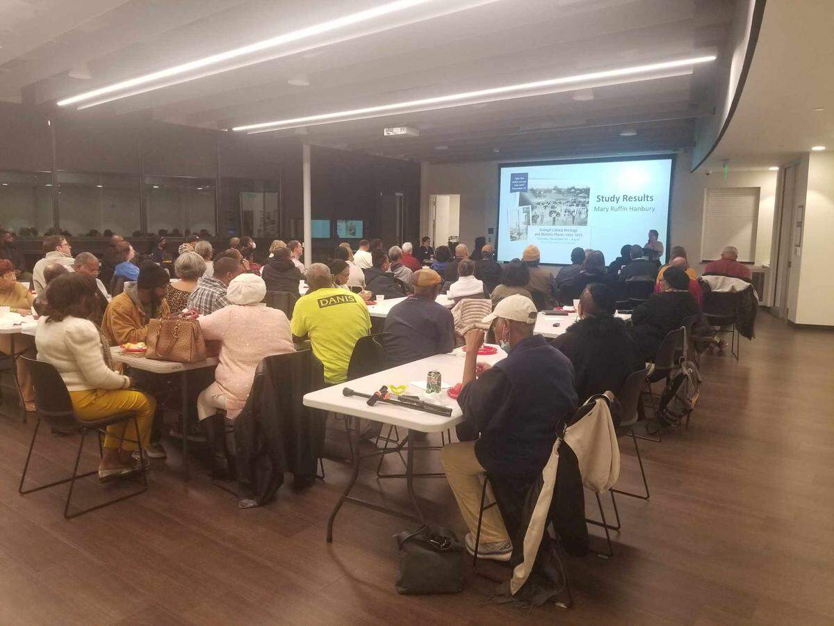 Community members attend a meeting about the draft study of the city’s Black Heritage and Historic Places. The meeting was held at Chavis Park Community Center on Nov. 30.