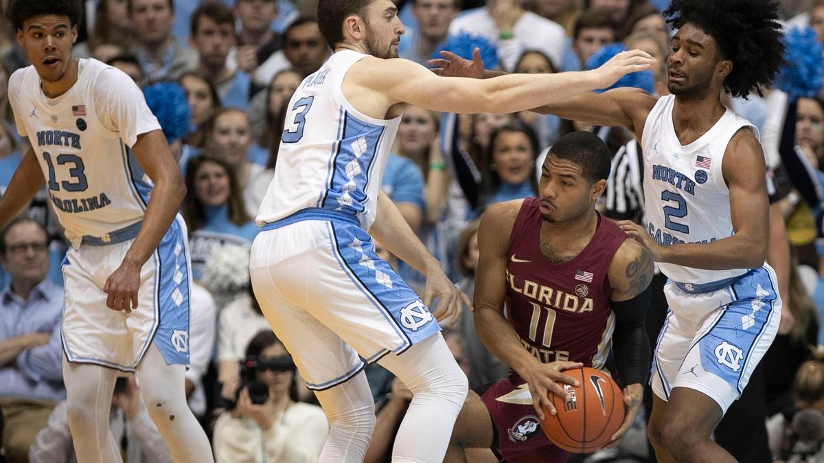 Florida State’s David Nichols (11) is trapped by North Carolina’s Coby White (2) and Andrew Platek (3) during the first half on Saturday, February 23, 2019 at the Smith Center in Chapel Hill, N.C.