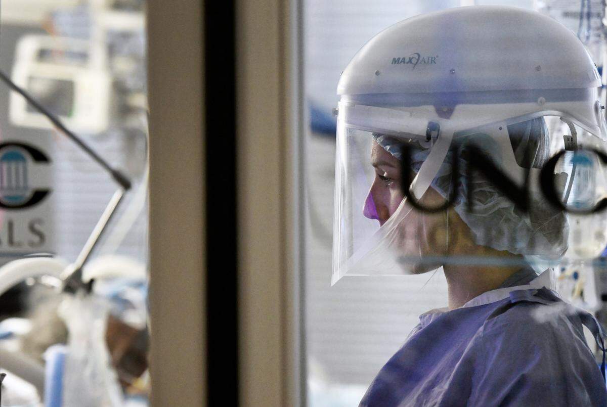 A nurse monitors a Covid patient in the Medical Intensive Care Unit at UNC Hospital in Chapel Hill, N.C. Thanksgiving Day, Thursday, Nov. 26, 2020.
