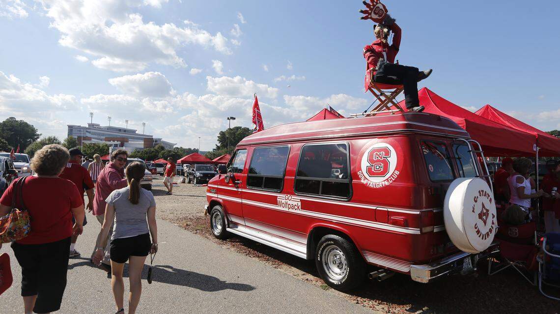 A mannequin dressed up as a wolf sitting on top of a red van marks the tailgating spot for Don Annas and his friends.  Photographed before N.C. State's game against Richmond Saturday, September 7, 2013, at Carter-Finley Stadium in Raleigh, N.C.