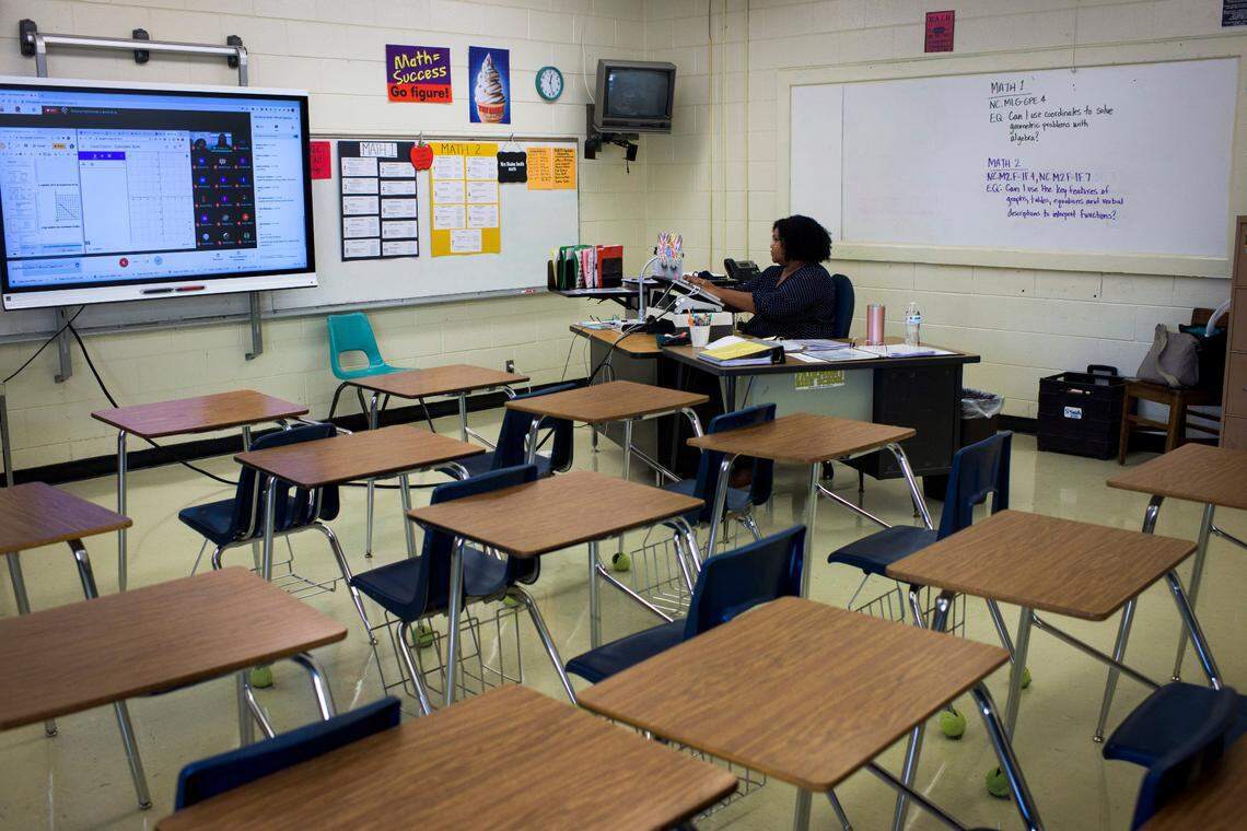 Shalon Smith teaches a virtual 9th-grade math class at Fairmont High School in Fairmont, N.C., Oct. 28, 2020. Millions of American students are grappling with the challenge of learning remotely without adequate home internet service, particularly in poorer locales like Robeson County.