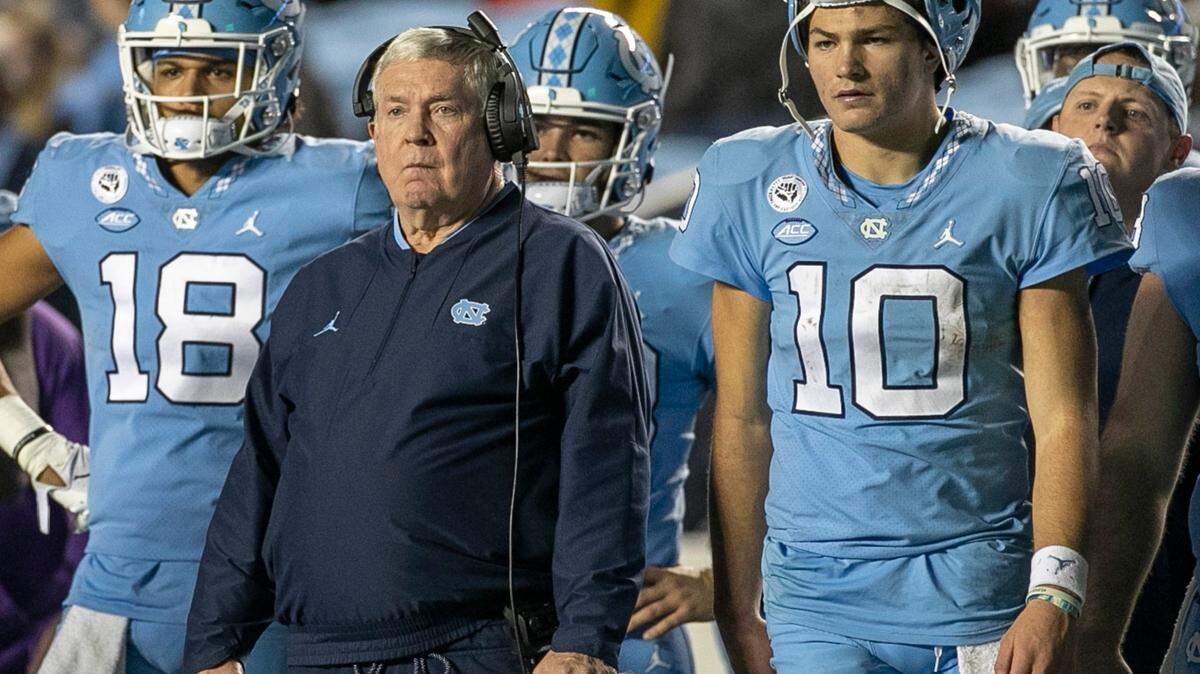 North Carolina quarterback Drake Maye and coach Mack Brown watch the extra point attempt by Noah Burnette to give the Tar Heels a 28-24 lead in the fourth quarter against Pitt on Saturday, October 29, 2022 at Kenan Stadium in Chapel Hill, N.C.