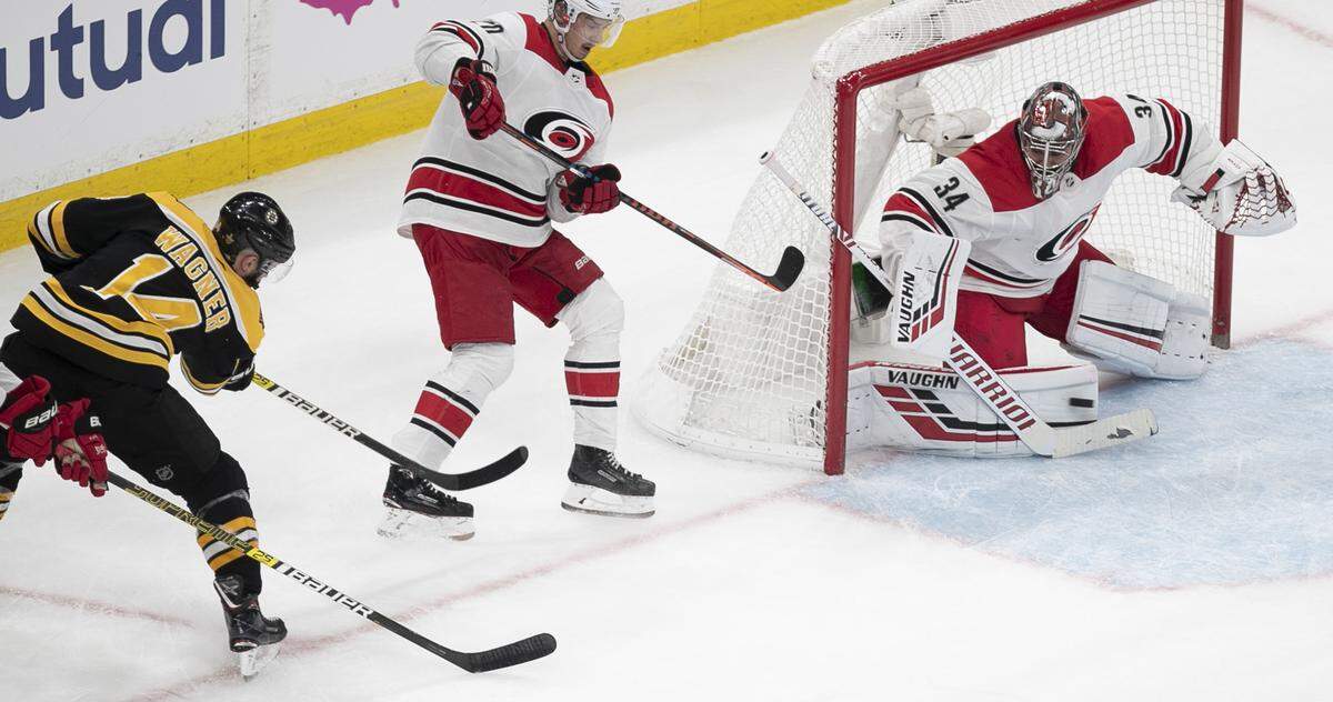 Carolina Hurricanes’ goalie Petr Mrazek (34) stops a scoring attempt by Boston Bruins’ Chris Wagner (14) during the second period in Game One of the Eastern Conference Finals on Thursday, May 9, 2019 at TD Garden in Boston, Mass.