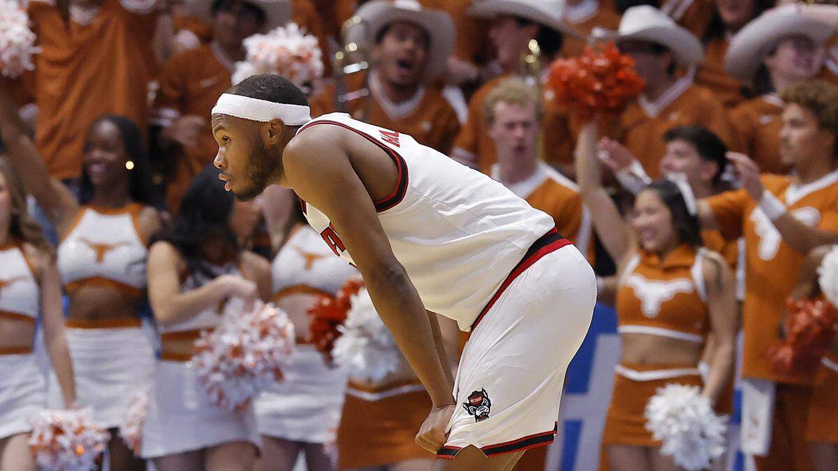 N.C. State’s Tre Holloman reacts after Texas’ Tramon Mark scored with seconds remaining in the Wolfpack’s 68-66 loss in the NCAA First Four on Tuesday, March 17, 2026, at the University of Dayton Arena in Dayton, Ohio. 