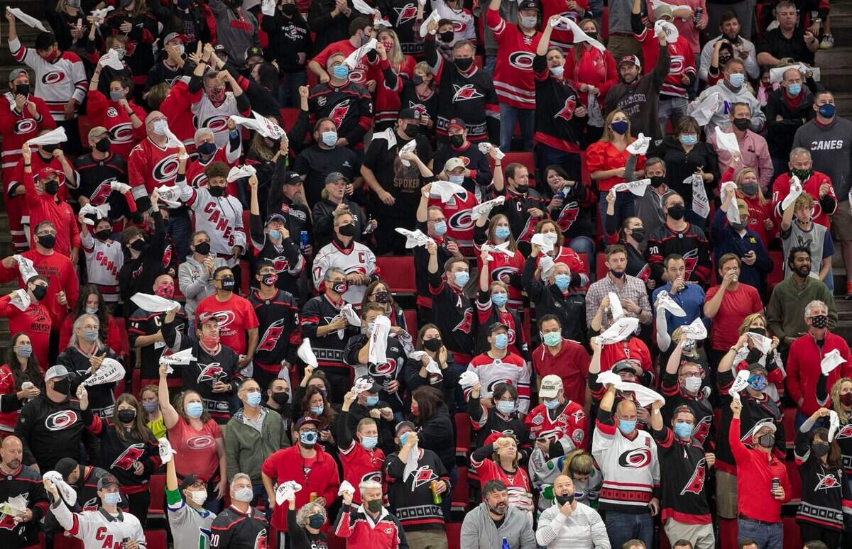 Fans celebrate after a goal by Carolina Hurricanes’ Jordan Staal (11) in the second period against Nashville in their first round Stanley Cup series game on Monday, May 17, 2021 at PNC Arena in Raleigh, N.C.