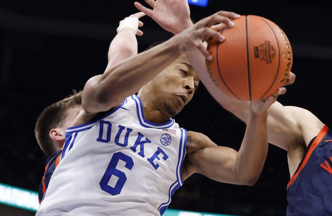 Duke’s Maliq Brown (6) pulls in a rebound during the first half of Duke’s game against Virginia in the finals of the 2026 ACC Men’s Basketball Tournament at the Spectrum Center in Charlotte, N.C., Saturday, March 14, 2026.