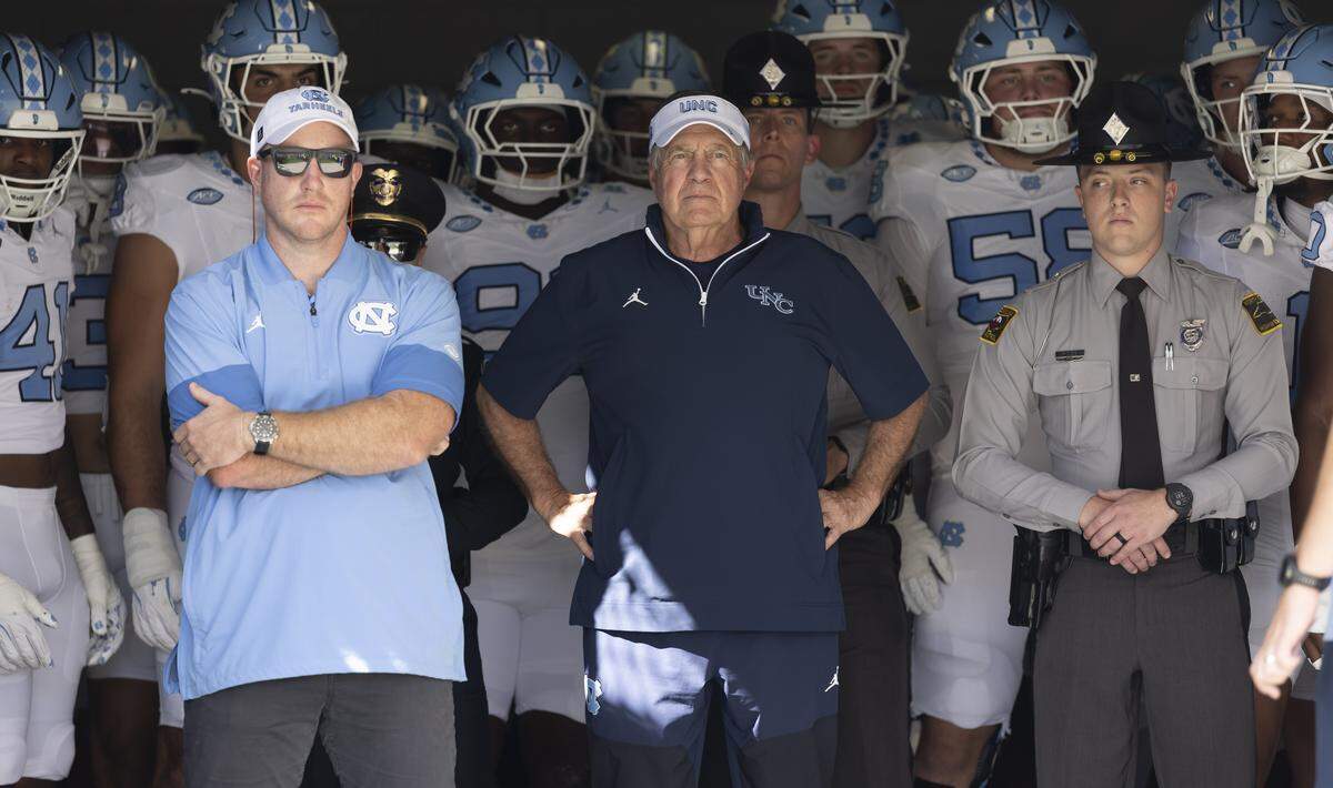 North Carolina coach Bill Belichick waits to enter Acrisure Bounce House Stadium with his players for the Tar Heels’ game against UCF on Saturday, September 20, 2025  in Orlando, Fla.