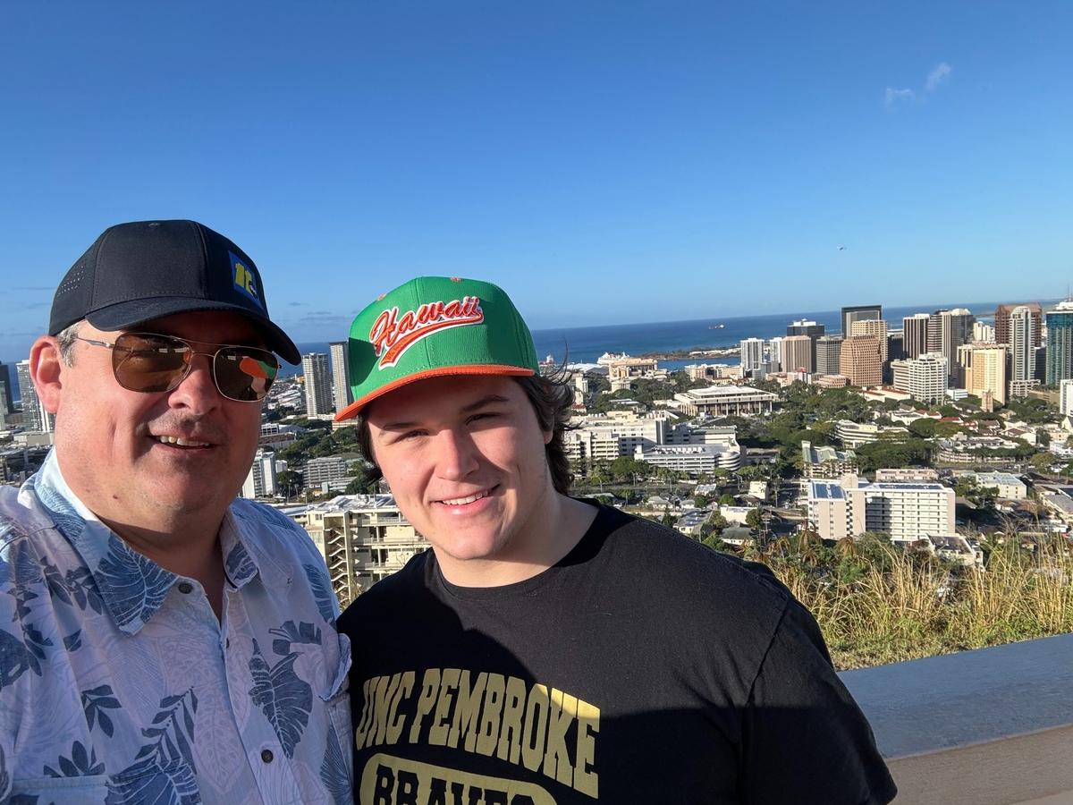 Don “Big Weather” Schwenneker and his son Mason in Hawaii during the younger Schwenneker’s research project work on Pearl Harbor. Father and son will graduate from UNC-Pembroke this weekend.