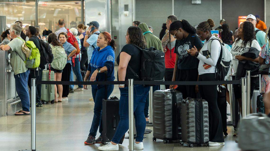 Passengers wait in Terminal 2 at RDU International Airport on Friday, July 19,2024 after a worldwide computer outage traced to a software update by the cybersecurity company CrowdStrike caused numerous canceled and delayed flights.