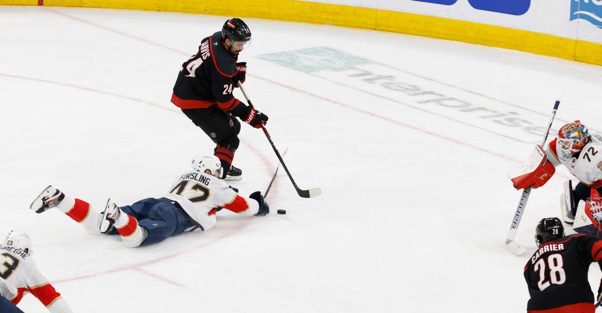 Carolina’s Seth Jarvis (24) loses control of the puck as Panthers’ Gustav Forsling (42) defends during the second period of the Carolina Hurricanes’ game against the Florida Panthers in Game 2 of the Eastern Conference Final at the Lenovo Center in Raleigh, N.C., Thursday, May 22, 2025.
