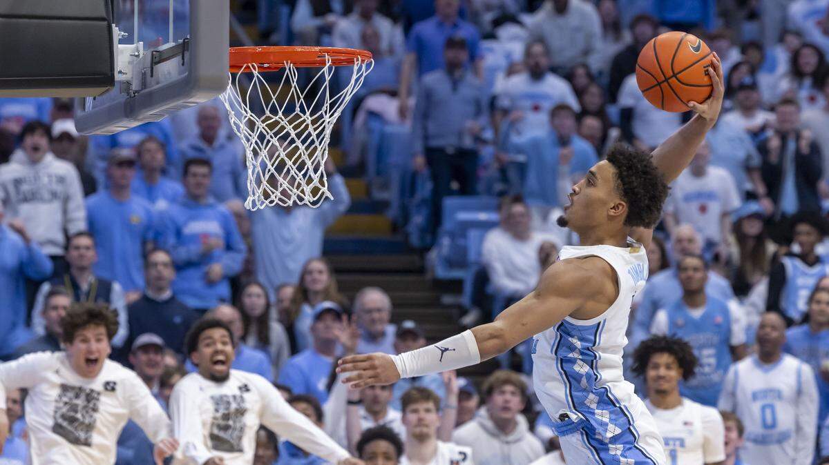 North Carolina guard Seth Trimble (7) soars to the rim for a break away dunk in the second half against Louisville on Monday, February 23, 2026 at the Smith Center in Chapel Hill, N.C. Trimble led all scores with 30 points, a career high, in the Tar Heels’ 77-74 victory.