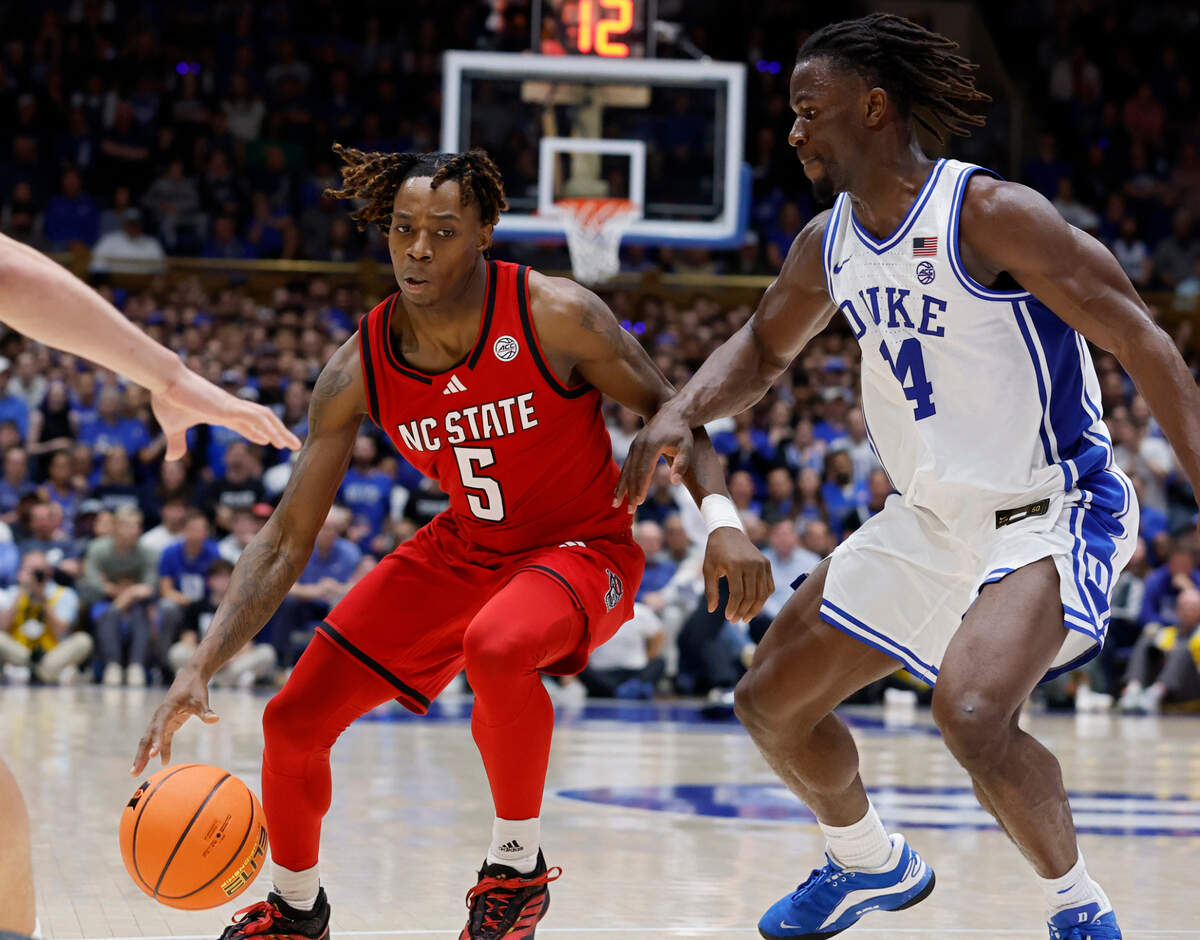 N.C. State’s Trey Parker drives past Duke’s Sion James during the second half of the Wolfpack’s 74-64 loss on Monday, Jan. 27, 2025, at Cameron Indoor Stadium in Durham, N.C.