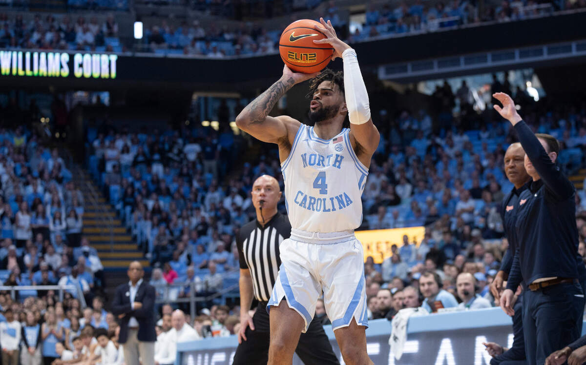 North Carolina’s R.J. Davis (4) launches a three-point shot in the first half against Syracuse on Saturday, January 13, 204 at the Smith Center in Chapel Hill, N.C. Davis led all scores with 22 points in the Tar Heels’ 103-67 victory.