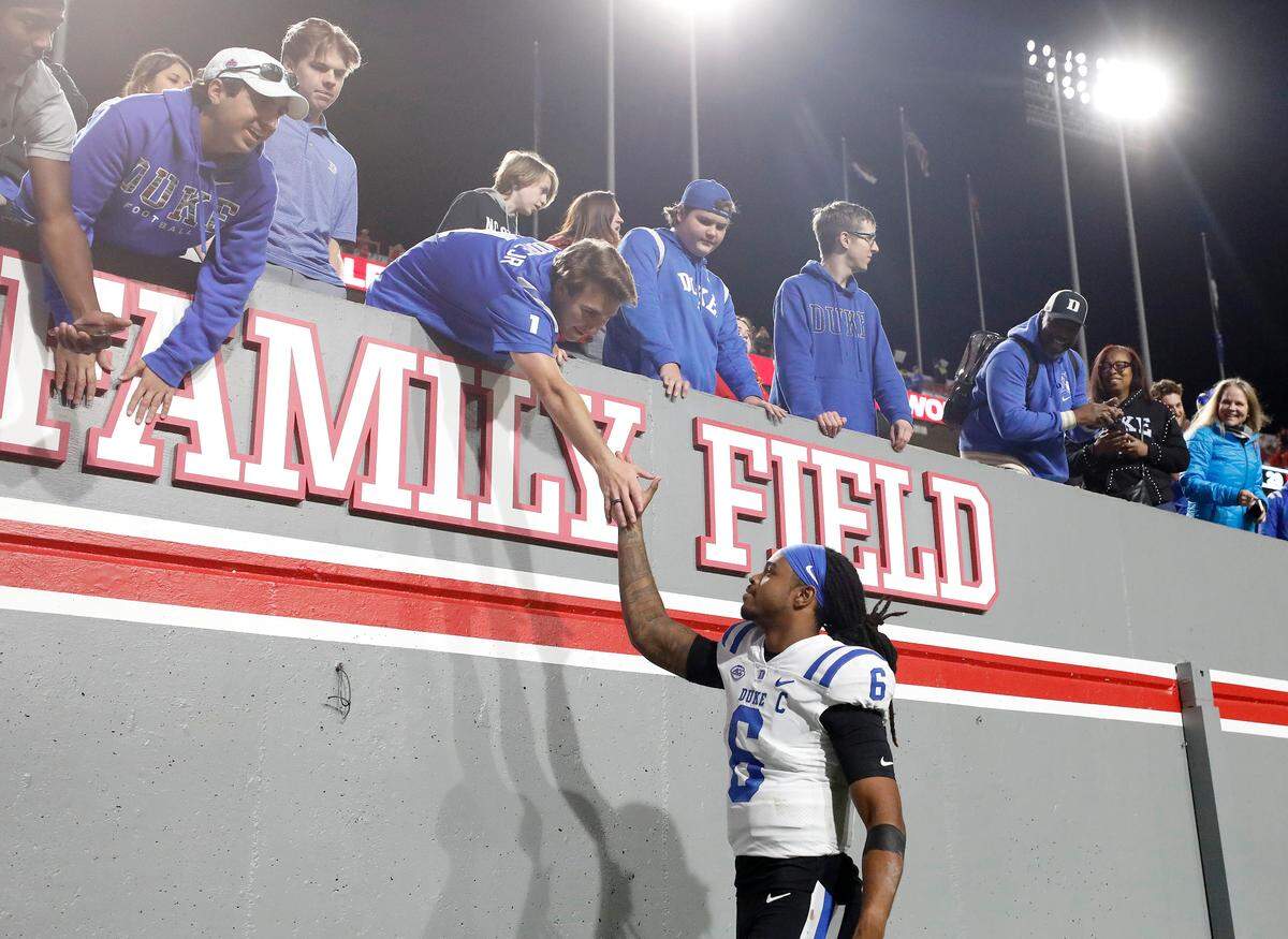 Duke quarterback Maalik Murphy celebrates with fans following the Blue Devils’ 29-19 win over N.C. State on Saturday, Nov. 9, 2024, at Carter-Finley Stadium in Raleigh, N.C.
