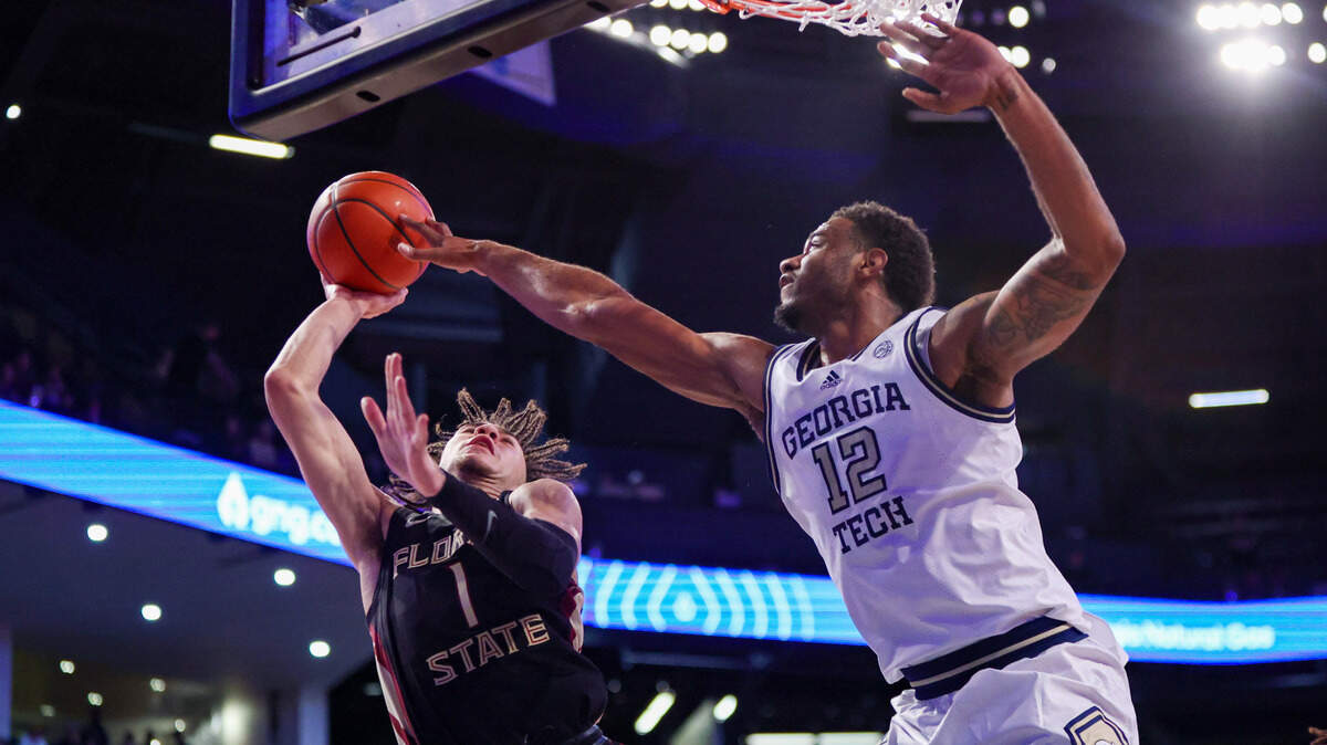 Mar 2, 2024; Atlanta, Georgia, USA; Florida State Seminoles guard Jalen Warley (1) shoots past Georgia Tech Yellow Jackets forward Tyzhaun Claude (12) in the first half at McCamish Pavilion.