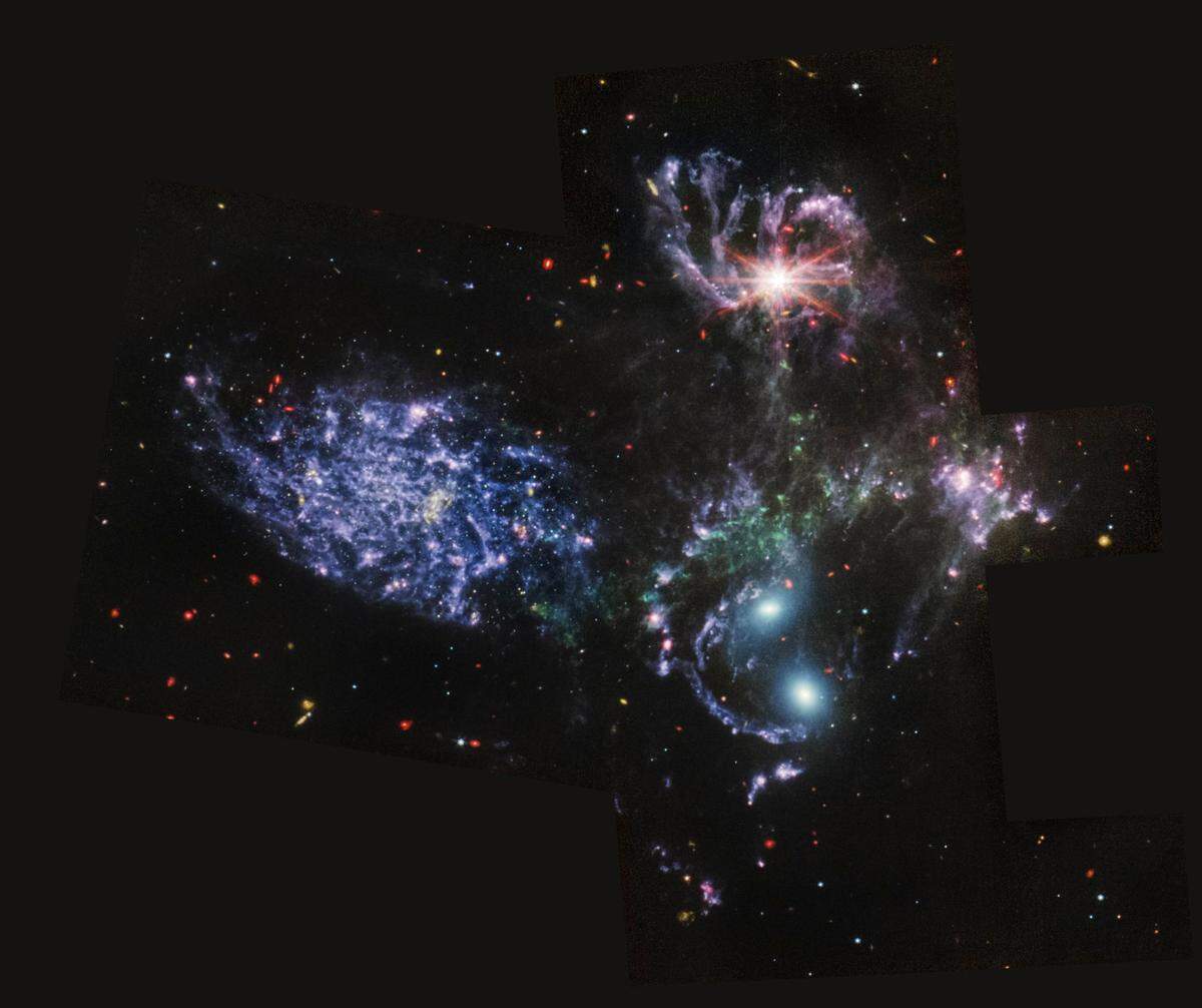 This image provided by NASA on Tuesday, July 12, 2022, shows Stephan’s Quintet, a visual grouping of five galaxies captured by the Webb Telescope’s Mid-Infrared Instrument (MIRI).
