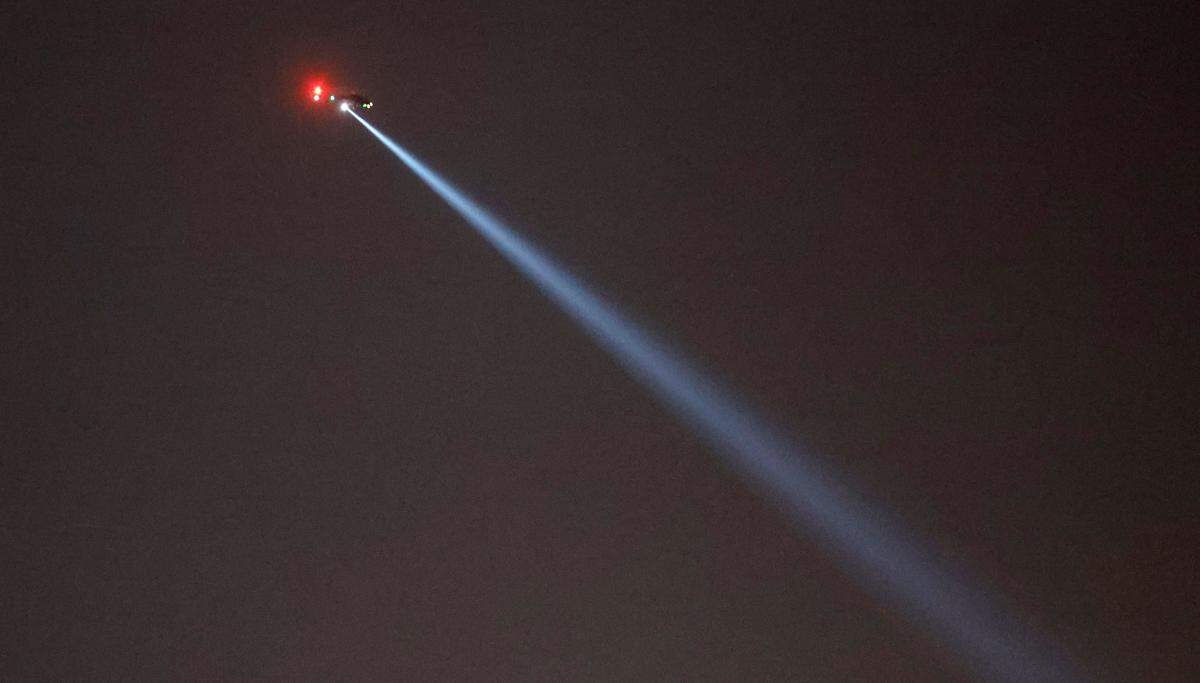 A helicopter hovers over I-540 in Raleigh, N.C., Thursday, October 13, 2022.