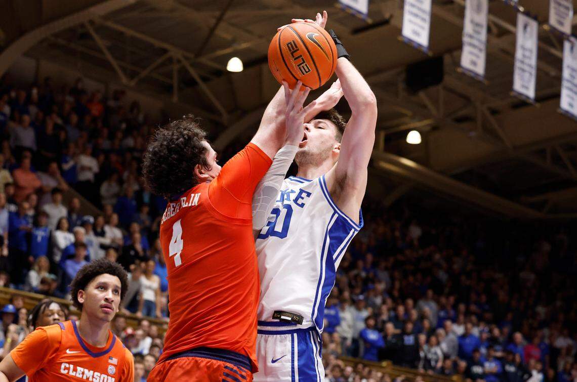 Duke’s Kyle Filipowski (30) is fouled by Clemson’s Ian Schieffelin (4) as Filipowski makes the shot with 15 seconds left in the game during Duke’s 72-71 victory over Clemson at Cameron Indoor Stadium in Durham, N.C., Saturday, Jan. 27, 2024.