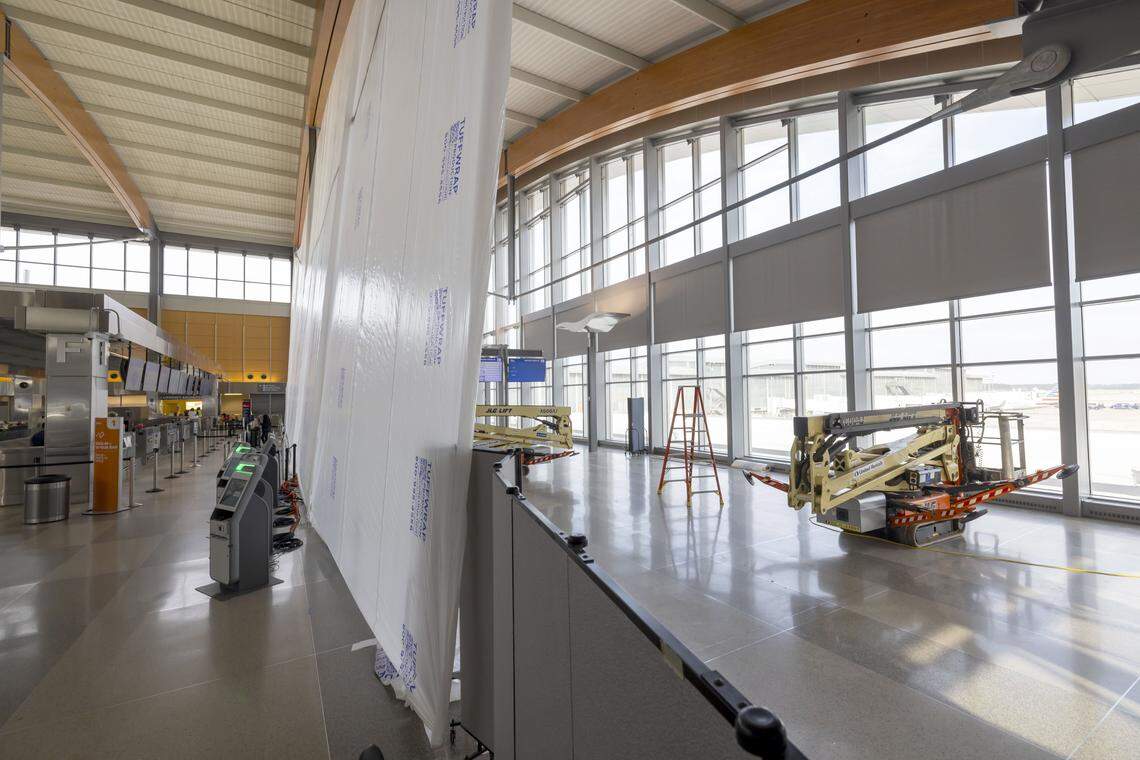 Expansion of Terminal 2 at RDU International Airport has begun with the installation of plastic over the windows on the north side of the terminal on Friday, January 9, 2026 in Morrisville, N.C.  The large terminal will have added ticketing, baggage, and space for Customs and  Border Protection.