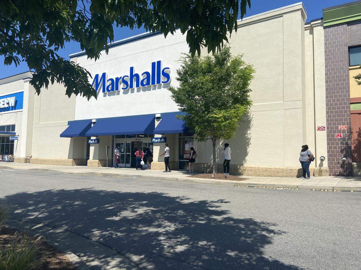Customers wait outside of Marshalls in Raleigh to shop. The line outside was about 10-15 deep as shoppers practiced social distancing.