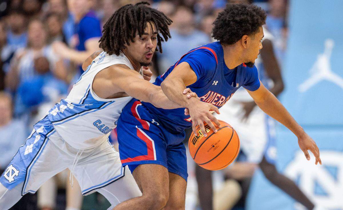 North Carolina guard Elliot Cadeau (3) makes a steal from American University’s Geoff Sprouse (12) during the first half on Friday, November 15, 2024 at the Smith Center in Chapel Hill, N.C.