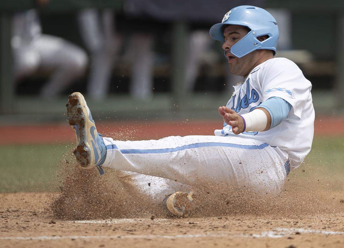 North Carolina’s Aaron Sabato (19) slides into home on a single by Ike Freeman in the fifth inning to give the Tar Heels’ a 4-2 lead over Auburn during the NCAA Super Regional on Saturday, June 8, 2019 at Boshamer Stadium in Chapel Hill, N.C.