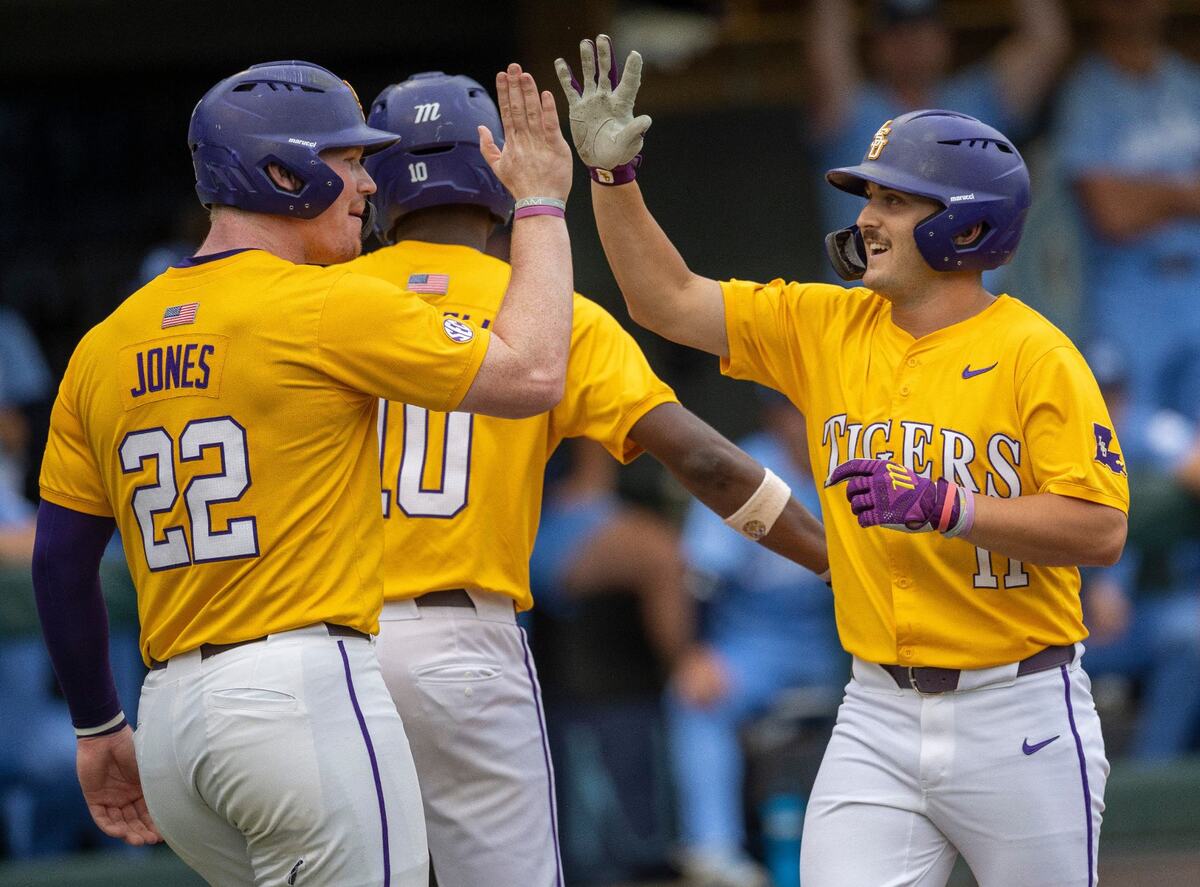 LSU left fielder Josh Pearson (11) is greeted at home plate by teammate Jared Jones (22) after connecting for a 2 RBI home run in the first inning against North Carolina during the NCAA Regional on Sunday, June 2, 2024 at Boshamer Stadium in Chapel Hill, N.C.