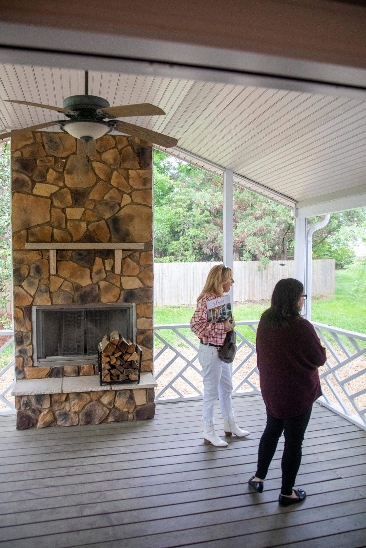 First-time home buyer Carolina Acuipil, right, and Real Estate Broker Colleen Blondell tour a home for sale in Cary on Thursday, April 27, 2023.