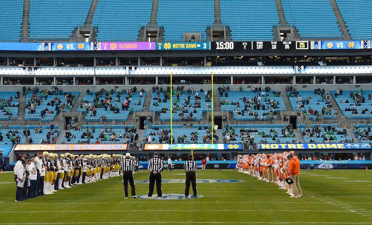 The Notre Dame Fighting Irish and Clemson Tigers stand on the field together following the first quarter as a show of unity at Bank of America Stadium in Charlotte, NC on Saturday, December 19, 2020. The Clemson Tigers and Notre Dame Fighting Irish faced off in the ACC Championship game.