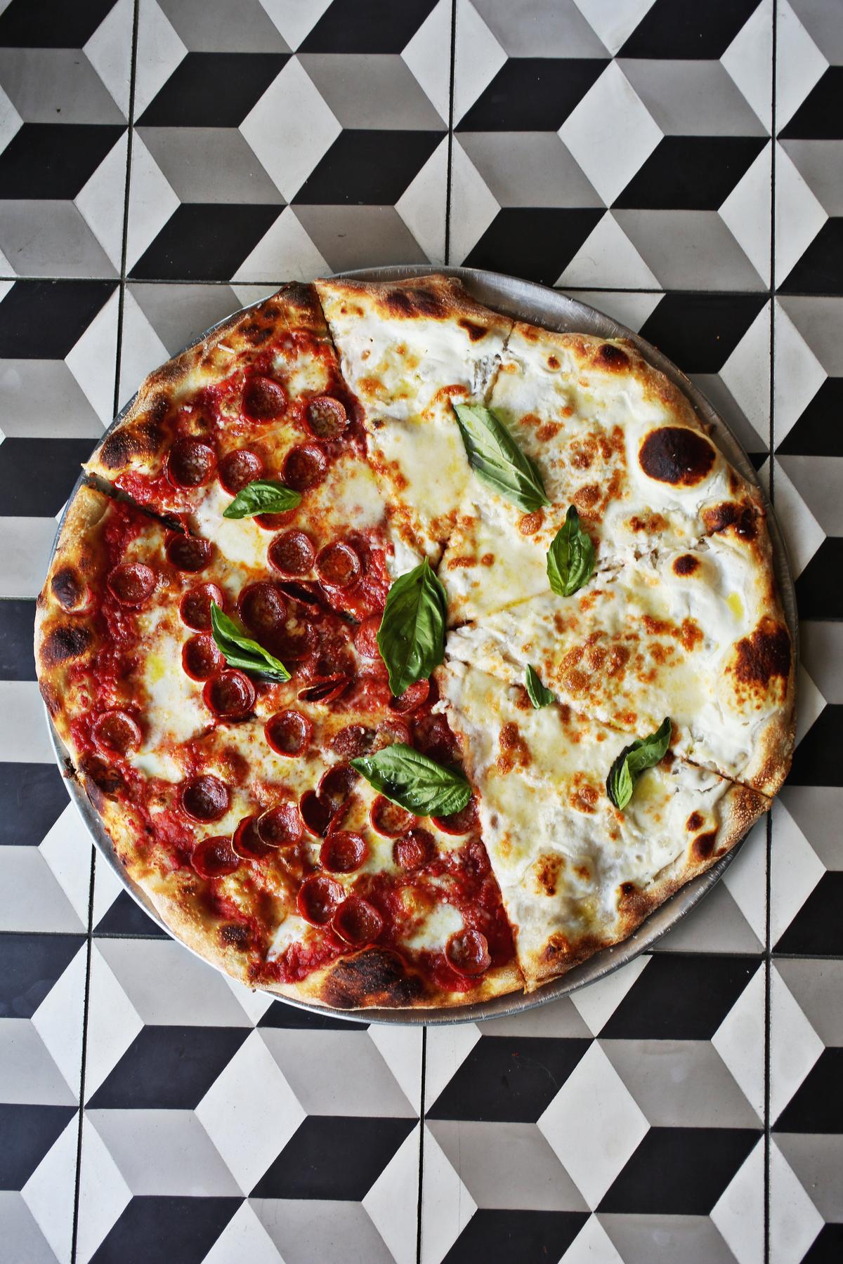 The 50/50 pie shown here is half pepperoni and white pizza at Oakwood Pizza Box in downtown Raleigh.