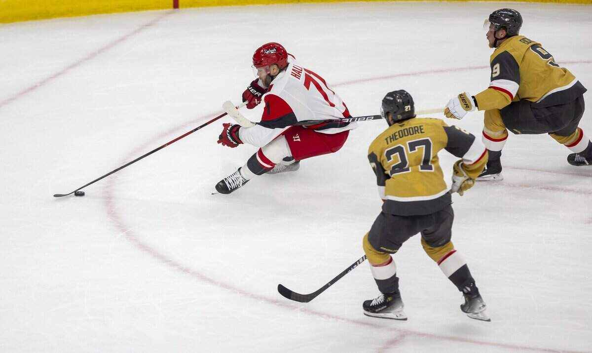 Vegas center Jack Eichel (9) is called for a penalty as he tries to slow Carolina Hurricanes left wing Taylor Hall (71) in the first period during Game 6 of the Stanley Cup Final, on Sunday, June 14, 2026 at T-Mobile Arena in Las Vegas, NV.