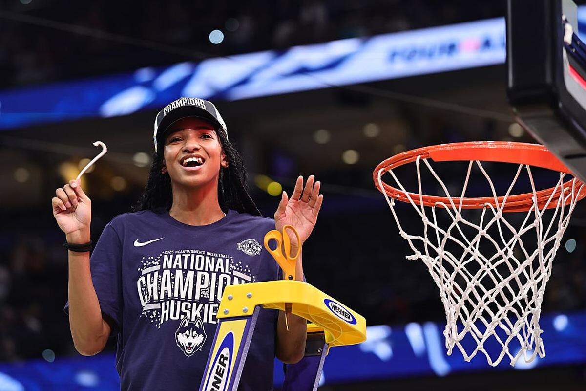 TAMPA, FLORIDA - APRIL 06: Qadence Samuels #10 of the UConn Huskies celebrates with a piece of the net after beating the South Carolina Gamecocks 82-59 to win the National Championship of the NCAA Women's Basketball Tournament at Amalie Arena on April 06, 2025 in Tampa, Florida. (Photo by Carmen Mandato/Getty Images)