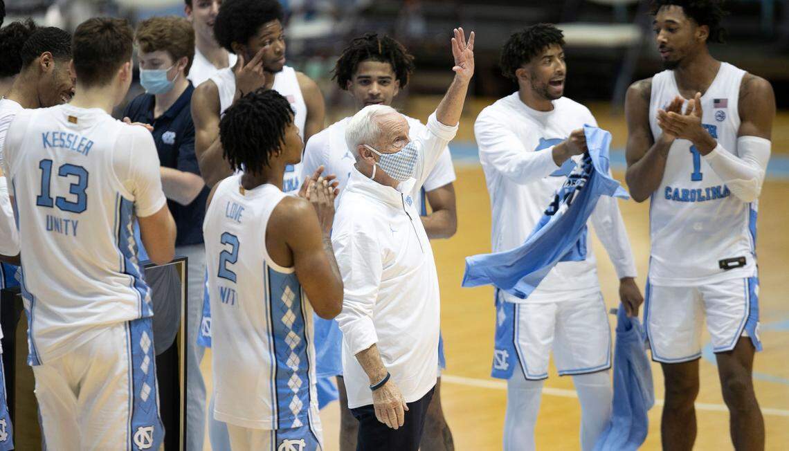 North Carolina coach Roy Williams acknowledges the crowd as he is honored for his 900th career win, following the Tar Heels’ 78-70 win over Florida State on Saturday, February 27, 2021 in Chapel Hill, N.C.