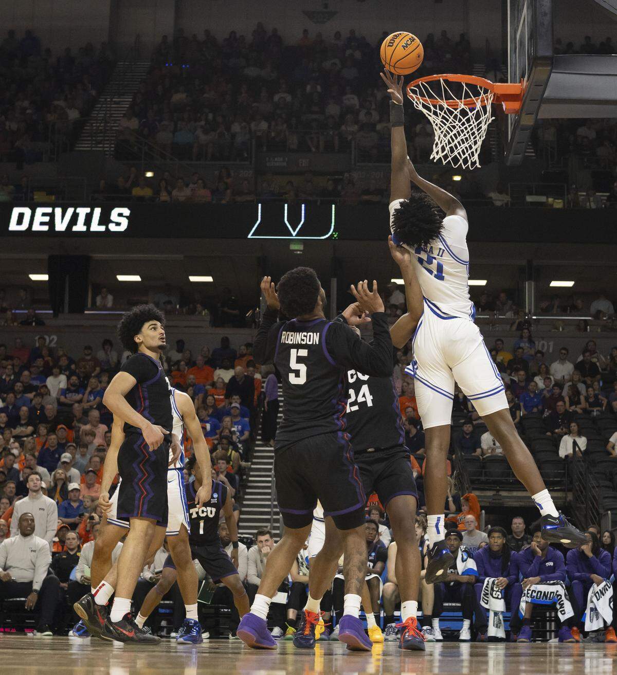 Duke center Patrick Ngongba II (21) scores in the first half against TCU on Saturday, March 21, 2026, during the second round of the NCAA Tournament at Bon Secours Arena in Greenville, S.C. Ngongba retuned to pay after missing five games with an injury. 