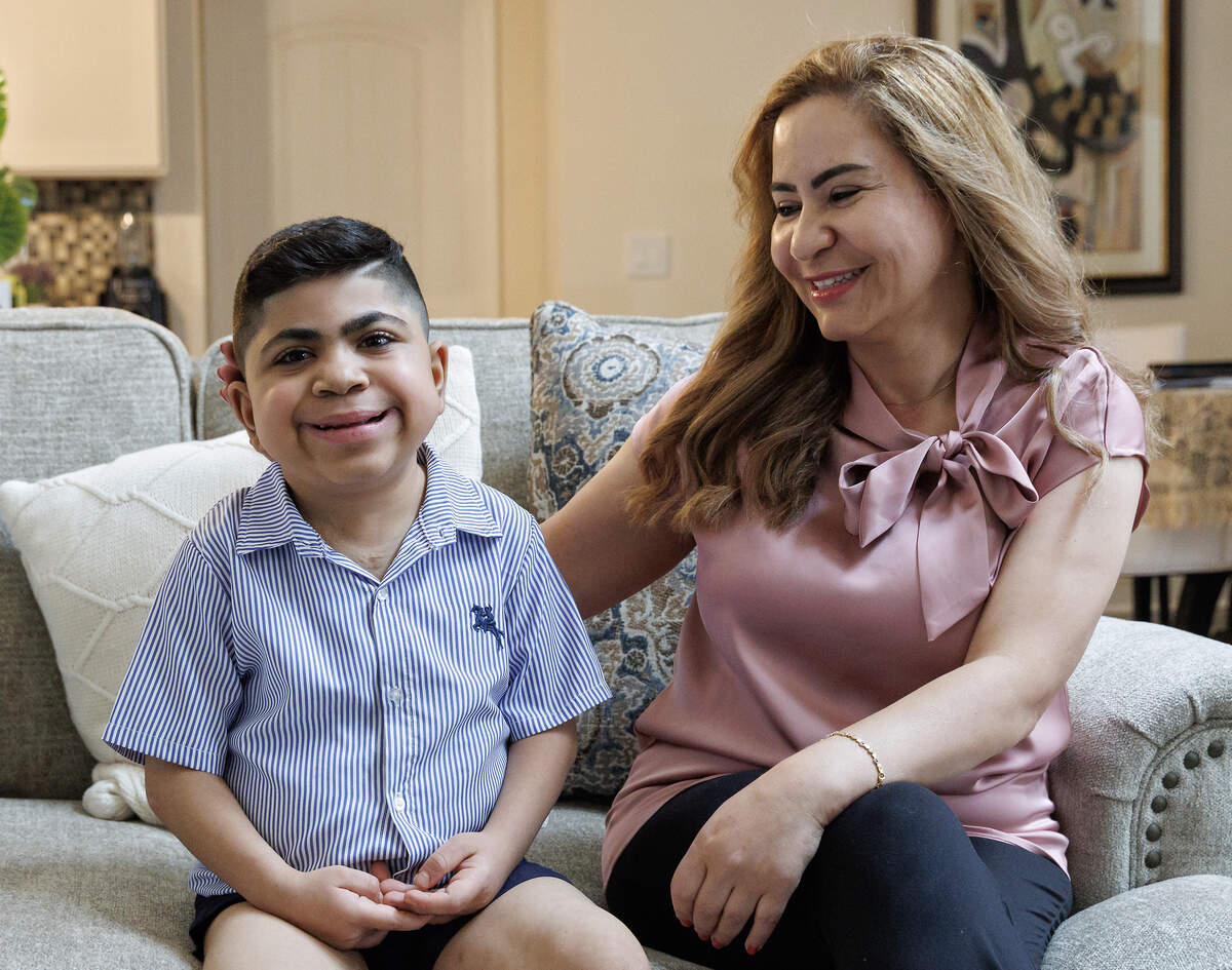 Yara and Saleh Ahmad at their home in Apex. A legal settlement with Wake County will allow Saleh to attend a private school and receive other services he needs to catch up on his education.