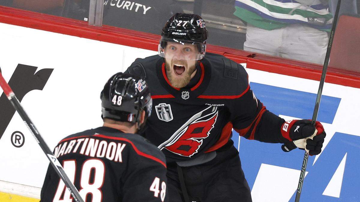 Carolina's Nikolaj Ehlers (27) celebrates with Jordan Martinook (48) after Ehlers scored in the first period of the Hurricanes’ game against the Golden Knights in the first game of the Stanley Cup Final at the Lenovo Center in Raleigh, N.C., Tuesday, June 2, 2026.