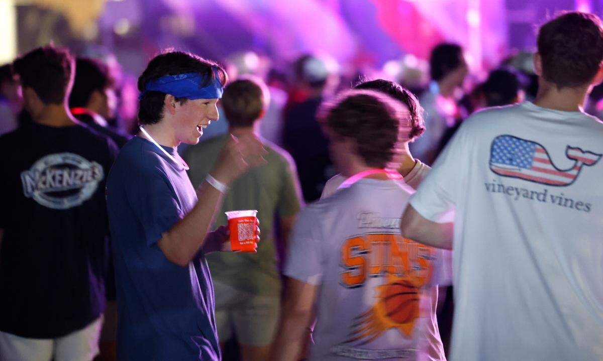 Attendees enjoy “Flagstock 2024,” an invite-only concert event featuring country musicians Big & Rich and Lee Greenwood, among others, at a location in Chapel Hill, N.C., Monday, Sept. 2, 2024. Flagstock started after a GoFundMe raised over $500,000 for a “rager” for UNC-Chapel Hill fraternity brothers who held up the American flag during an April campus protest.