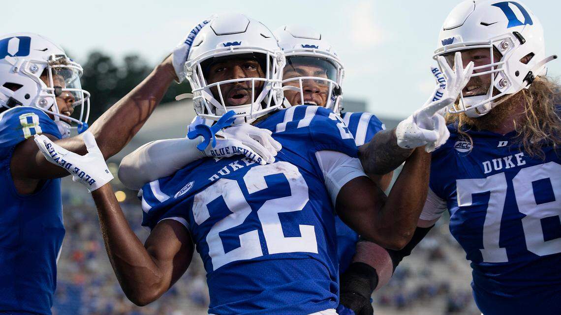 Duke running back Jaylen Coleman (22), center, celebrates with teammates after scoring a touchdown during the first quarter of the Blue Devilsí season opener against Temple at Wallace Wade Stadium on Friday, Sept. 2, 2022, in Durham, N.C.