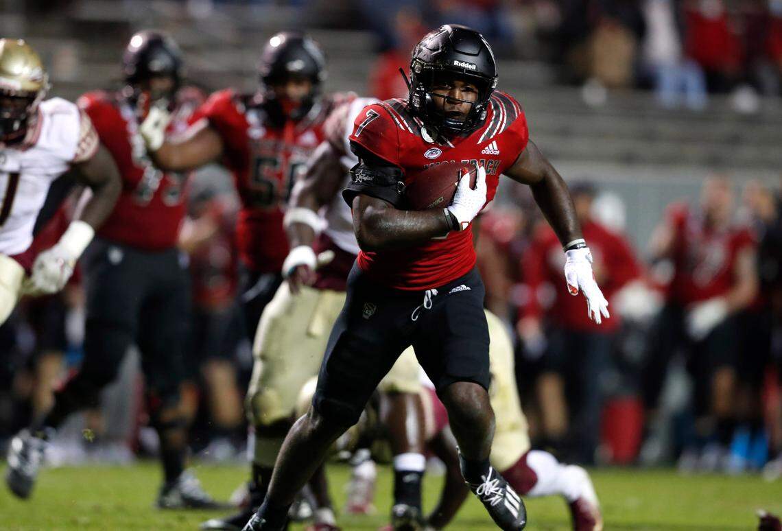 N.C. State running back Zonovan ‘Bam’ Knight (7) heads towards the end zone on a 18-yard touchdown run during the second half of N.C. State’s 38-22 victory over Florida State at Carter-Finley Stadium in Raleigh, N.C., Saturday, Nov. 14, 2020.