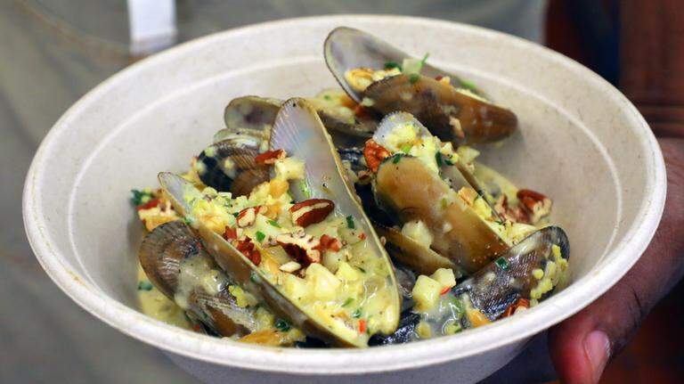 Chef Ricky Moore demonstrates preparation of his mussels dish