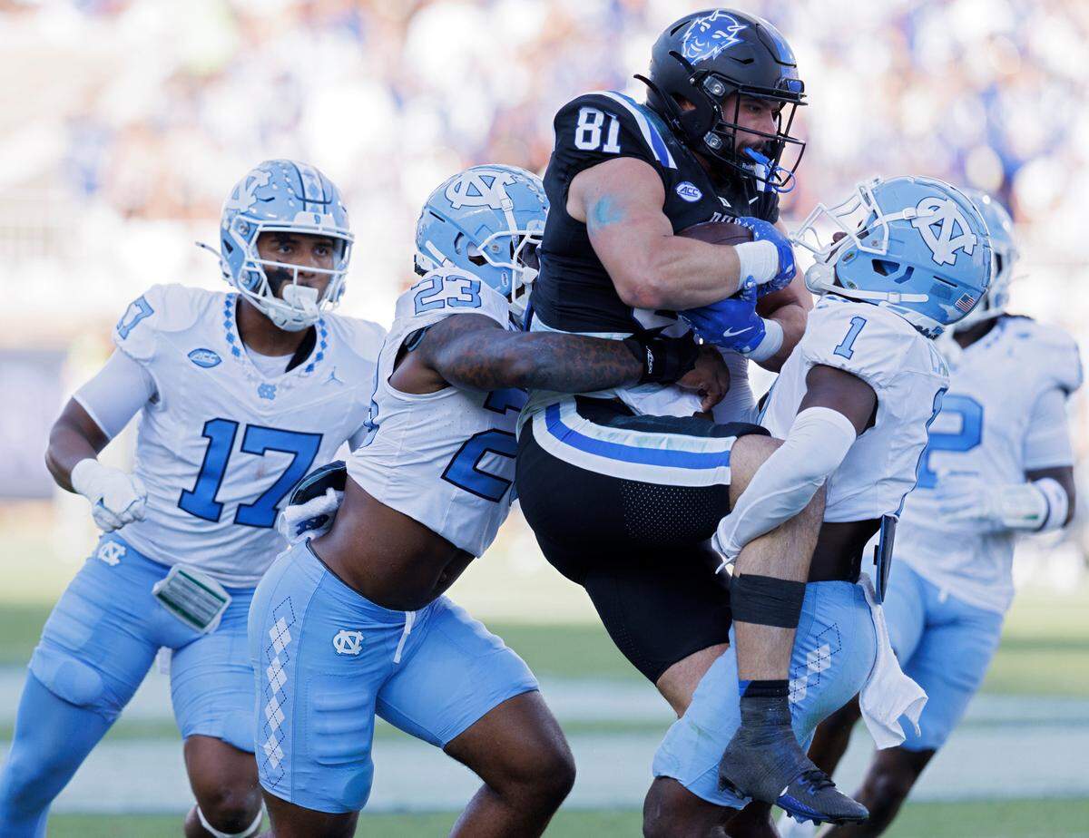 Duke’s Nicky Dalmolin is tied up by North Carolina’s Power Echols and Antavious Lane during the first half of the Blue Devils’ game on Saturday, Sept. 28, 2024, at Wallace Wade Stadium in Durham, N.C.