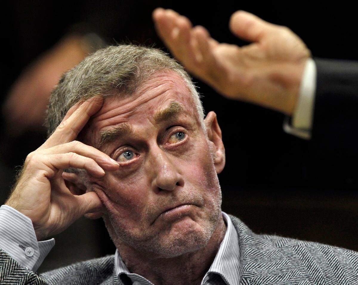 Michael Peterson listens as his defense attorney David Rudolph makes his opening statements in Peterson’s request for a new trial Tuesday, Dec.6, 2011.