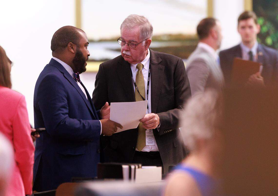 Rep. Terry Brown, a Democrat from Mecklenburg, speaks with Rep. Donny Lambeth, a Republican from Forsyth, prior to a session in the House chamber of the Legislative Building on Wednesday, May 21, 2025, in Raleigh, N.C.