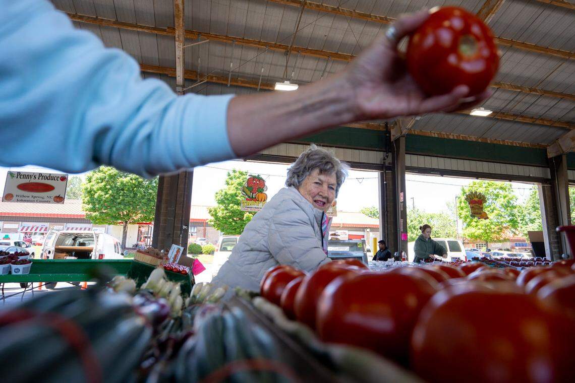Eleanor Winfrey shops for tomatoes at the State Farmers Market in Raleigh, N.C. in 2022.