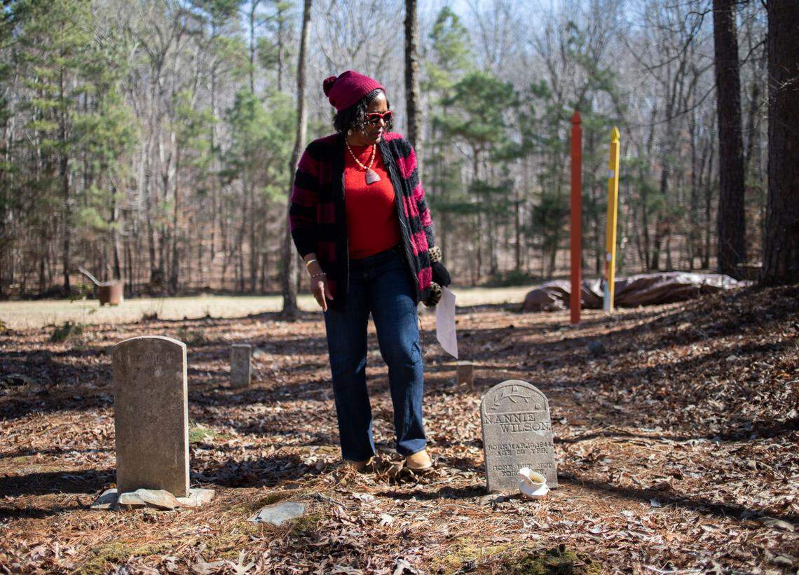 Retired Judge Beverly Scarlett talks about her family’s connection to a section of land in Hillsborough, N.C. while standing near the gravestones of relatives on Wednesday, Feb. 15, 2022.